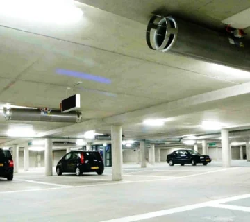 Intelligent ventilation system for public parking lots based on pollution measurement: necessity and performance